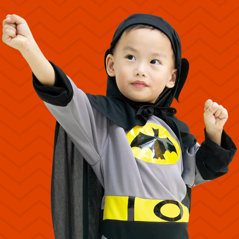 child batman costume orange background
