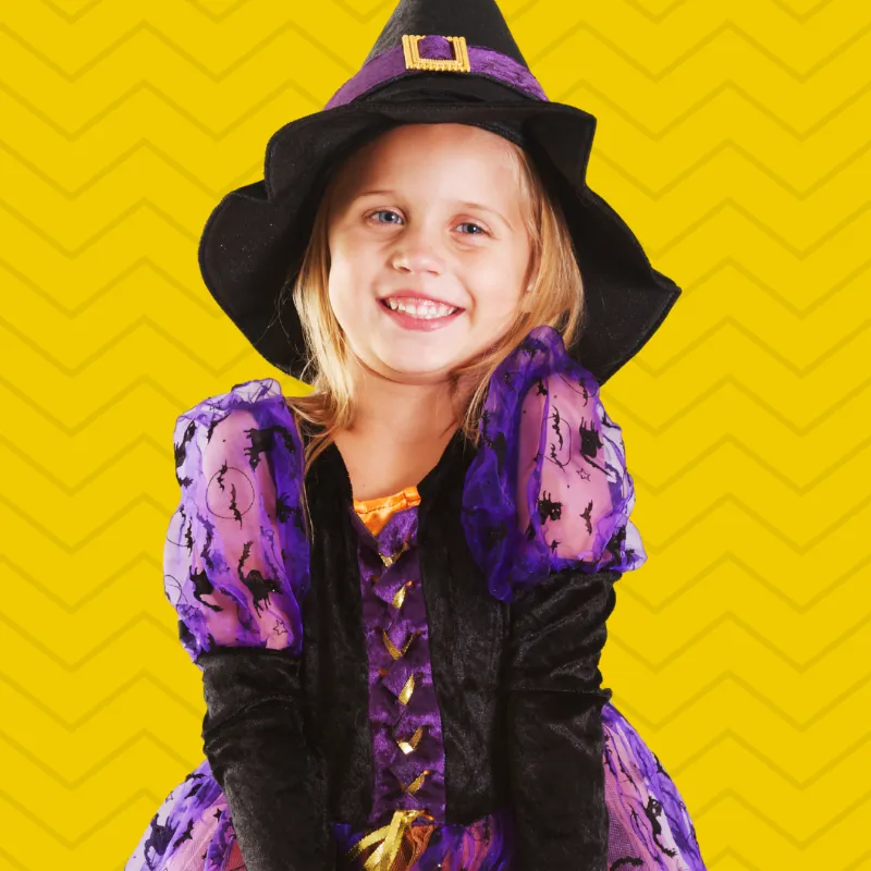 girl halloween costume yellow background
